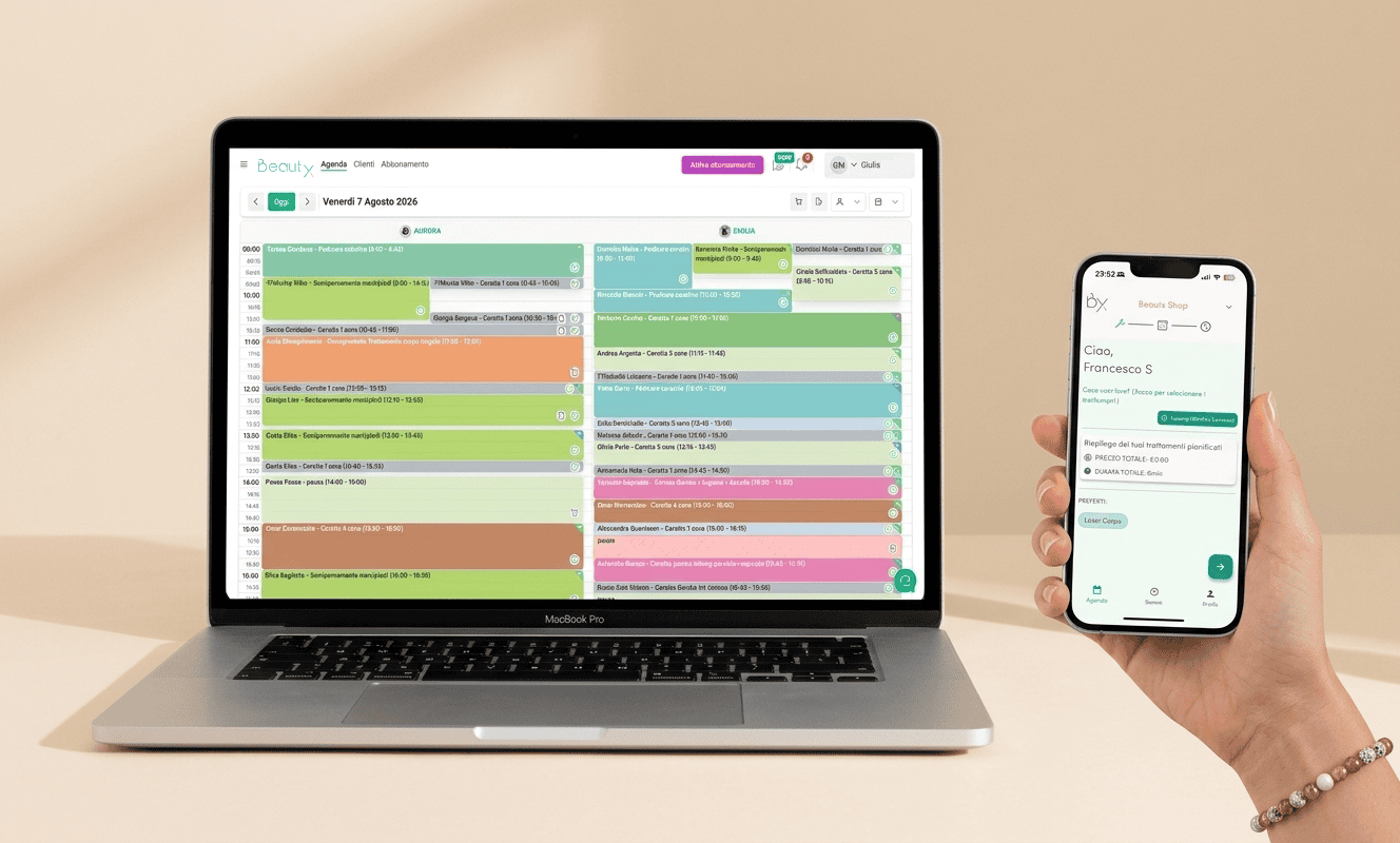 Laptop and smartphone displaying beauty salon management app interface.